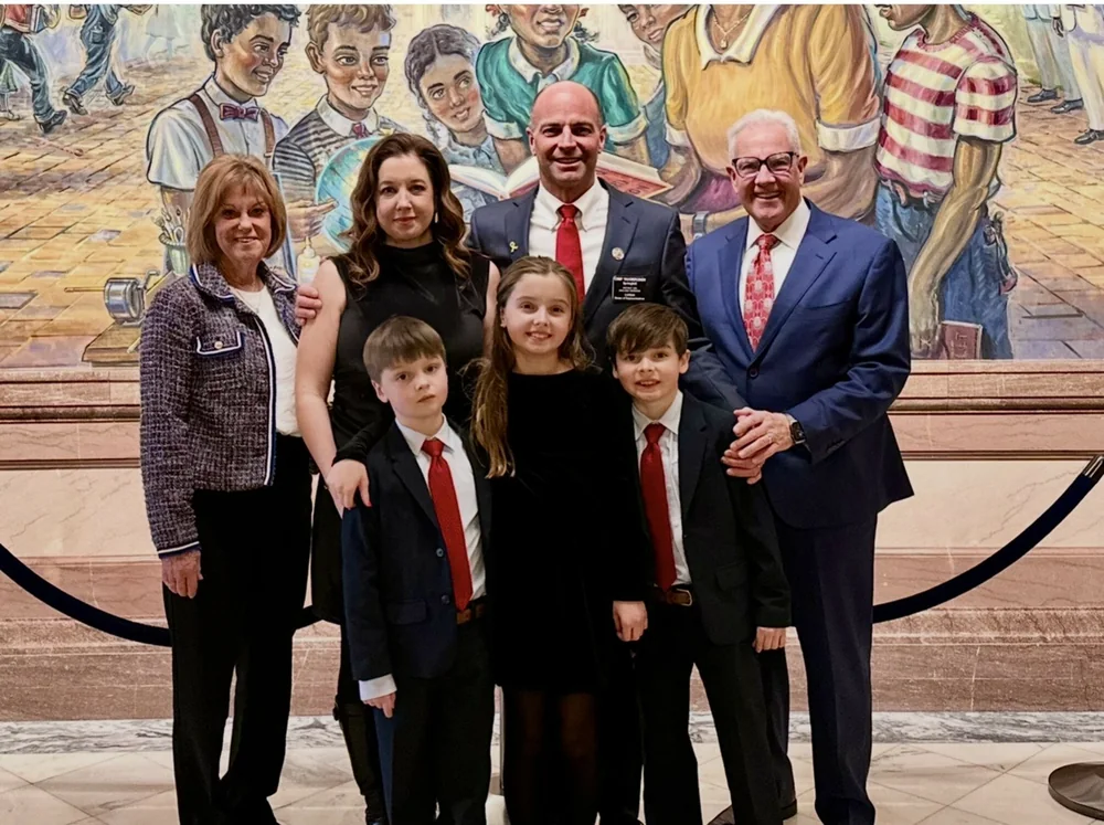 Chip VanHouden with his family at the Kansas Statehouse